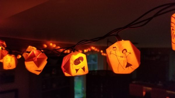 Halloween holiday tradition orange origami ball, feat. Dan and Miranda