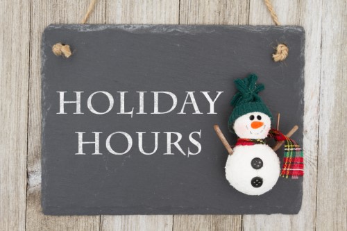 reevaluate your audio holiday hours sign