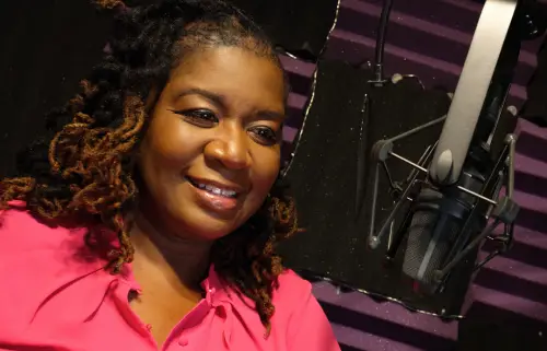 African American voice talent, Saundi, in studio